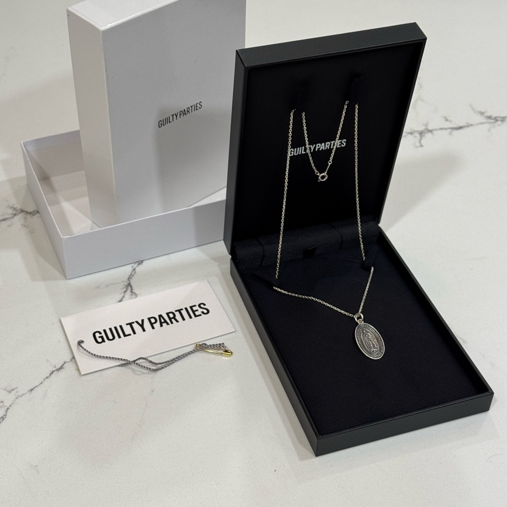 Guilty Parties Silver Medallion Pendant Necklace